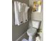 Close-up of a toilet with a Chanel artwork at 1428 Casterton Cir, Davenport, FL 33897