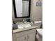 Cozy bathroom with a granite vanity, toilet, and neutral decor, creating a calming space at 1428 Casterton Cir, Davenport, FL 33897