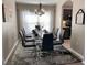 Elegant dining room with modern decor, hardwood floors, and lots of natural light at 1428 Casterton Cir, Davenport, FL 33897