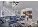 Spacious living room featuring high ceilings, hardwood floors, and open access to the kitchen at 1428 Casterton Cir, Davenport, FL 33897