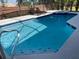 Inviting backyard pool with lounge chairs, spa and a refreshing place for relaxation at 1428 Casterton Cir, Davenport, FL 33897
