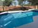 Sparkling pool with plenty of room for relaxing and entertaining guests at 1428 Casterton Cir, Davenport, FL 33897