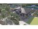 Modern amenity center with pickleball courts, lounge chairs, and outdoor seating in a Primary-planned community at 1461 Santorini Way, Tavares, FL 32778
