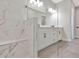 Bathroom featuring a glass enclosed shower, double sink vanity with black fixtures, and tiled floors at 1461 Santorini Way, Tavares, FL 32778