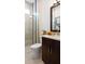 Modern bathroom featuring a glass-enclosed shower, stylish vanity, and sleek fixtures; a perfect blend of design and functionality at 1461 Santorini Way, Tavares, FL 32778