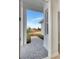 Inviting front entrance featuring a gray brick walkway and well-maintained landscaping leading to the home at 1461 Santorini Way, Tavares, FL 32778