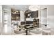 Well-lit kitchen and dining area with modern cabinets and a stainless steel refrigerator at 1461 Santorini Way, Tavares, FL 32778