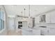 Clean kitchen showcasing a center island, pendant lights, and built in stainless steel appliances at 1461 Santorini Way, Tavares, FL 32778