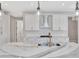 Modern kitchen showcasing a center island with sink and granite countertop at 1461 Santorini Way, Tavares, FL 32778