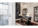 Home office featuring a modern desk, stylish decor, and ample natural light at 1461 Santorini Way, Tavares, FL 32778