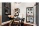 Modern office with custom desk, elegant furnishings, and refined decor; perfect for a professional workspace at 1461 Santorini Way, Tavares, FL 32778
