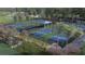 Enjoy active living with well-maintained pickleball courts surrounded by lush landscaping at 1461 Santorini Way, Tavares, FL 32778