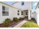 Backyard with a patio, brick paver walkway, and green grass at 15408 Lebeau Loop, Winter Garden, FL 34787