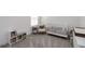 Cozy Bedroom with neutral decor, crib, chair, and shelving for books and toys at 15408 Lebeau Loop, Winter Garden, FL 34787