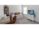 Bedroom with desk, sewing machine and TV at 15408 Lebeau Loop, Winter Garden, FL 34787