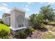 Community entrance features landscaped flower beds and attractive signage offering a warm welcome at 15408 Lebeau Loop, Winter Garden, FL 34787