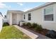 Home exterior featuring a well-maintained lawn, brick walkway, and tidy landscaping for enhanced curb appeal at 15408 Lebeau Loop, Winter Garden, FL 34787