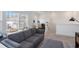 Cozy loft area with a comfortable gray sofa and adjacent study/office space, creating a versatile living area at 15408 Lebeau Loop, Winter Garden, FL 34787