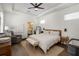 Serene main bedroom with neutral tones, tray ceiling, and en-suite bathroom access at 15408 Lebeau Loop, Winter Garden, FL 34787