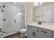 Beautiful bathroom featuring a glass shower and a vanity with marble countertop at 15702 Vetta Dr, Bella Collina, FL 34756