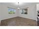 Bright dining room with natural light, modern light fixture, and hardwood floors at 15702 Vetta Dr, Bella Collina, FL 34756
