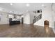 Open concept featuring tile flooring, a modern kitchen, and staircase, perfect for entertaining at 15702 Vetta Dr, Bella Collina, FL 34756