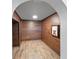 Cute nook features wood paneled walls, tiled floors, a recessed light, and a framed picture of a dog at 15702 Vetta Dr, Bella Collina, FL 34756
