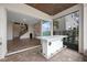 Outdoor patio with a white bar and indoor-outdoor flow to the living area at 15702 Vetta Dr, Bella Collina, FL 34756