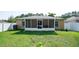 Fenced backyard with screened in porch in a well-maintained residential neighborhood at 16116 Corner Lake Dr, Orlando, FL 32820