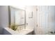 Well-lit bathroom with a modern sink, vanity, and neutral color scheme at 16116 Corner Lake Dr, Orlando, FL 32820