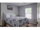 Comfortable bedroom featuring a bright window view and ample storage in the bed frame at 16116 Corner Lake Dr, Orlando, FL 32820