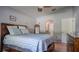 Comfortable bedroom featuring vaulted ceiling, and ensuite closet with easy access to the main room at 16116 Corner Lake Dr, Orlando, FL 32820