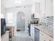 Bright kitchen featuring white cabinets, stainless steel appliances, and a stylish backsplash at 16116 Corner Lake Dr, Orlando, FL 32820