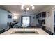 Well-lit living room featuring hardwood floors and access to the backyard via sliding glass doors at 16116 Corner Lake Dr, Orlando, FL 32820