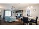 Open-concept living and dining area with hardwood floors and contemporary decor at 16116 Corner Lake Dr, Orlando, FL 32820