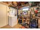 Utility basement featuring a washer, dryer, workbench, and storage at 1615 Crestwood Dr, Orlando, FL 32804