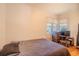 Neutral bedroom with a comfy bed, window, and entertainment center at 1615 Crestwood Dr, Orlando, FL 32804