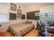 Eclectic bedroom featuring hardwood floors and unique decor at 1615 Crestwood Dr, Orlando, FL 32804