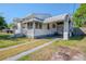 Cozy home displaying a convenient covered carport and driveway at 1615 Crestwood Dr, Orlando, FL 32804