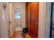 Hallway leading to a bathroom with an adjacent storage closet at 1615 Crestwood Dr, Orlando, FL 32804