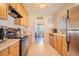 Well-lit kitchen with stainless steel appliances and spacious countertops at 1615 Crestwood Dr, Orlando, FL 32804