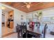 Cozy sunroom with a wooden table, decor, and access to an adjacent kitchen at 1615 Crestwood Dr, Orlando, FL 32804