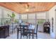 Bright sunroom with wood ceilings, tile flooring, and multiple windows for natural light at 1615 Crestwood Dr, Orlando, FL 32804