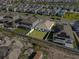 An aerial view of the property shows a private backyard in a desirable neighborhood at 1773 Groveline Rd, St Cloud, FL 34771
