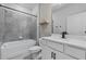 Well-appointed bathroom with tub, shower, and vanity with modern fixtures at 1773 Groveline Rd, St Cloud, FL 34771