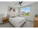 Cozy bedroom with neutral decor, large window, and stylish furnishings at 1773 Groveline Rd, St Cloud, FL 34771