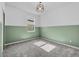 Bedroom featuring green wood paneling and carpeting at 1773 Groveline Rd, St Cloud, FL 34771