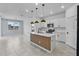 Modern kitchen features a stylish island with pendant lighting and stainless steel appliances at 1773 Groveline Rd, St Cloud, FL 34771