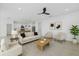 Bright, open living room with modern furnishings and an adjacent kitchen, creating an inviting space at 1773 Groveline Rd, St Cloud, FL 34771