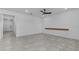 Minimalist style living room features hard flooring and ceiling fan at 1773 Groveline Rd, St Cloud, FL 34771